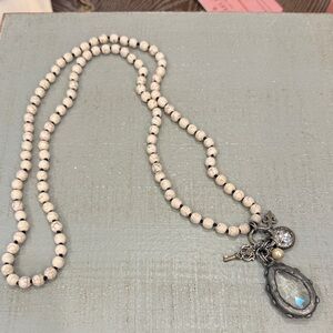 Elegant Beaded Necklace with Charms